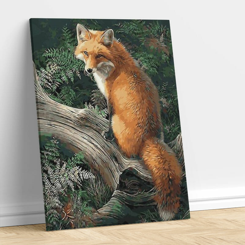 Fuchs auf einem Baumstumpf